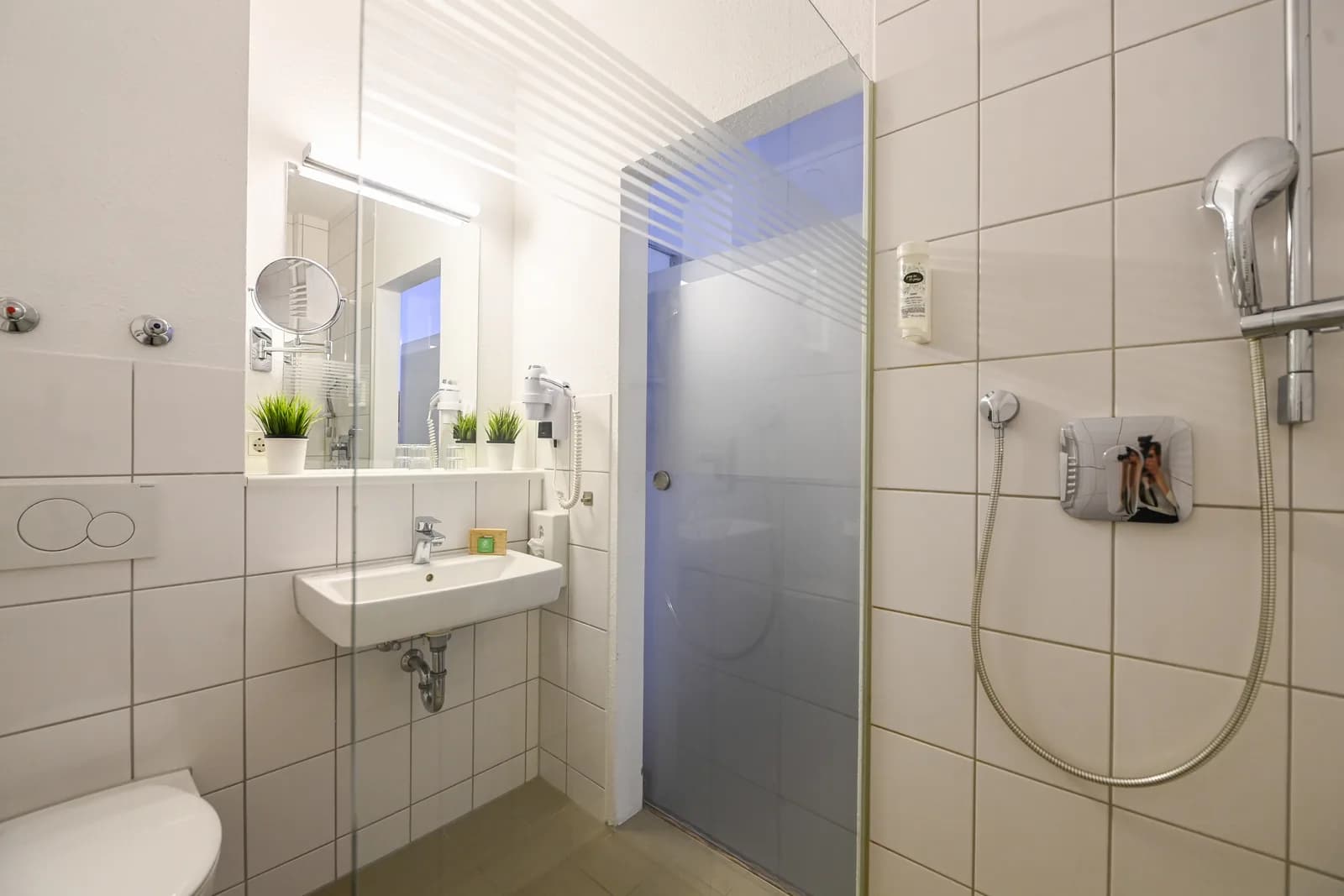 Bathroom with shower and heated towel rail